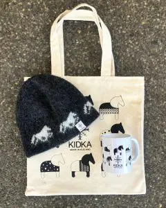 This Kidka Horse Gift Set includes a charming Kidka horse cup, a cozy black horse beanie made from Icelandic wool in Iceland, and a free horse tote bag.