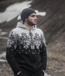 "Ás" hooded cardigan black, black hoodie with white pattern and a full length zipper. Made from Icelandic wool