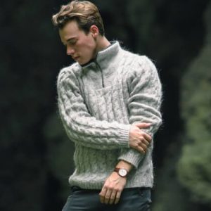 "Kafald" half-zip sweater. Grey cableknit troyer with fleecelined neckline. Made from Icelandic wool  