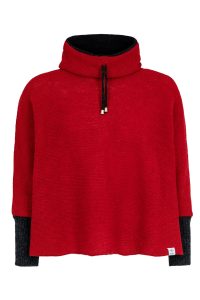 "Blær" short poncho red, short red poncho with sleeves, a high, fleecelined collar, featuring black drawstrings with metal tips.