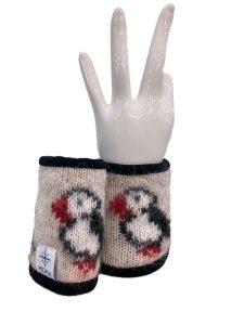 Beige puffin wrist warmers made from Icelandic wool, lined with black fleece