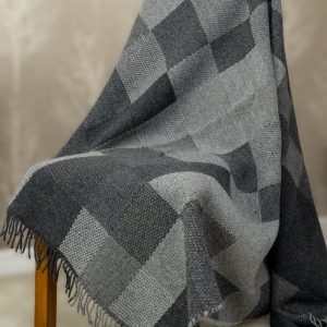 The Summer/Winter weaving pattern shows two contrasting sides—one light, one dark. In this gray and black version, it echoes the winter season, where the pale glow of short days meets the deep darkness of long nights. The shifting tones woven together reflect the quiet rhythm of winter light and shadow. Beautiful, versatile, and made with endurance in mind, our bedcovers and sofa covers are designed to enhance your home and make every space feel truly special.