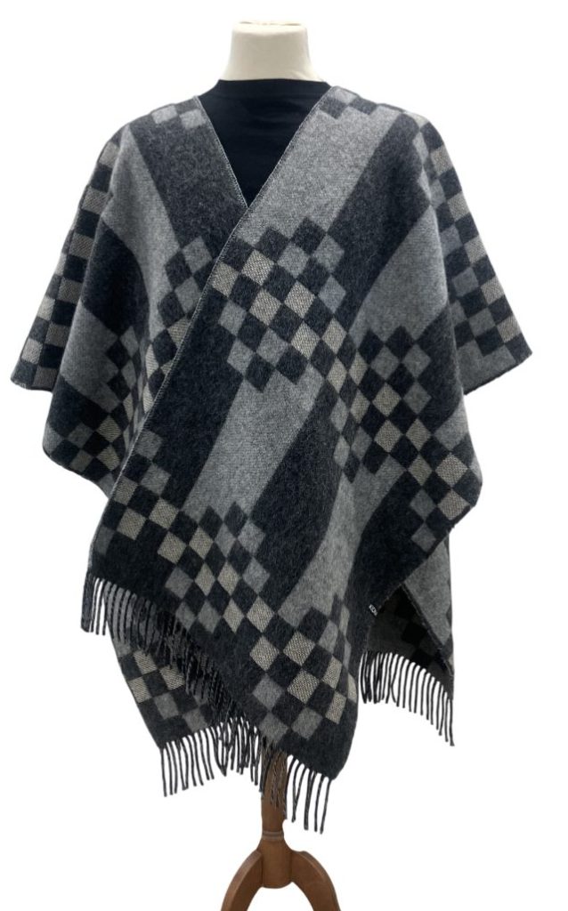 KIDKA ReCover Basalt is a woven warm, sturdy and elegant wool poncho. Easy to wear & the soft, durable material keeps you warm on cooler days. Icelandic wool & Merino